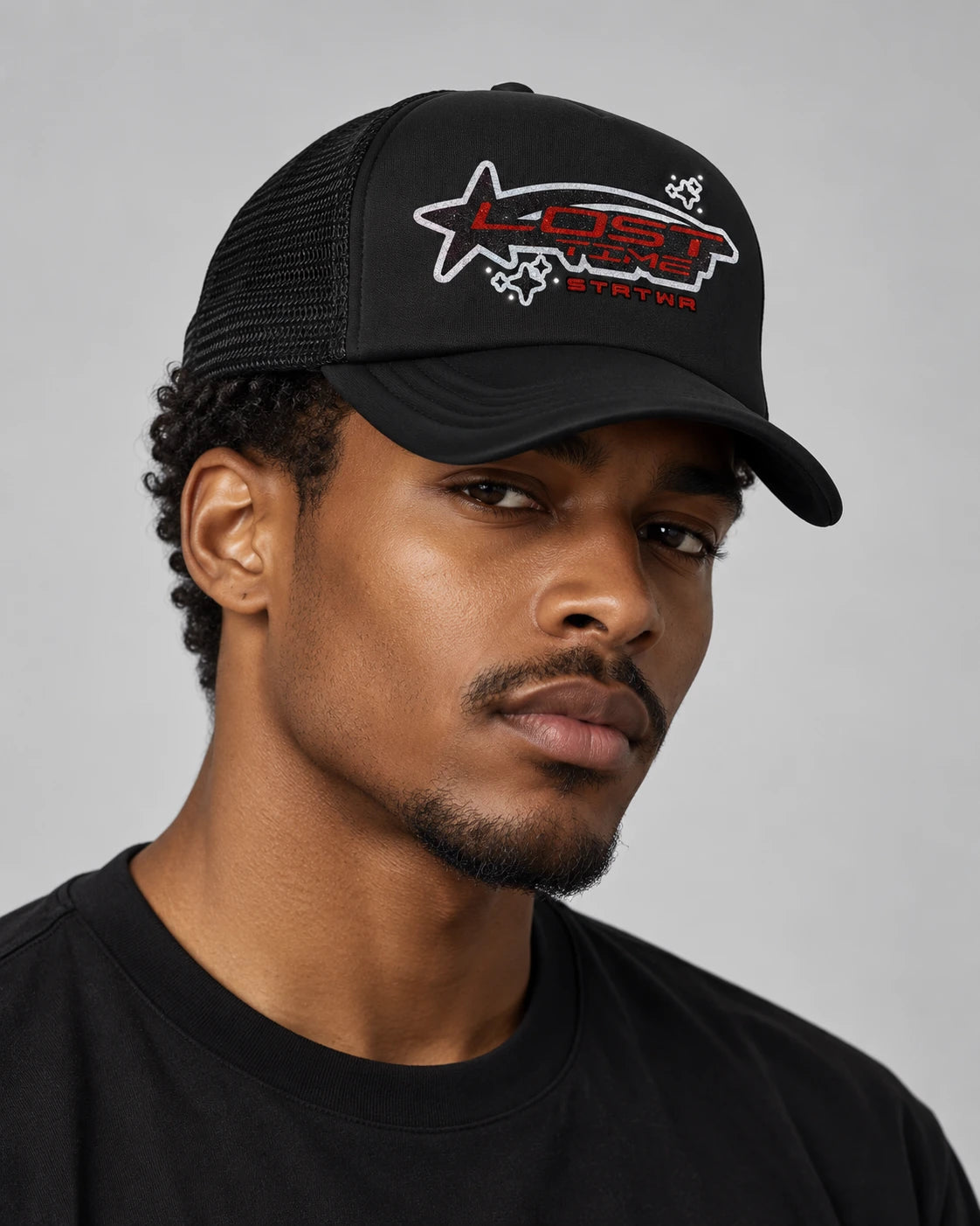 Model wearing "LOST STAR" TRUCKER HAT